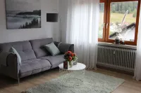 Freshly renovated, bright and friendly apartment with a view of the woods