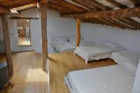 Stone house with garden, barbecue and fireplace.