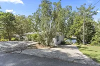 Family - Friendly Lakefront Home with a Covered Boat-slip.