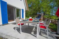 Picturesquely situated thatched-roof house in a large park-like garden