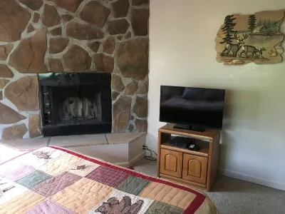 Privacy! One  & 1/2 acre with wrap around deck. Backs the National Forest.