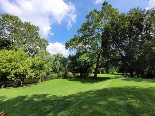 Waterfront with Wood Fireplace + Outdoor Firepit + Paddleboat +1 mile to outlets