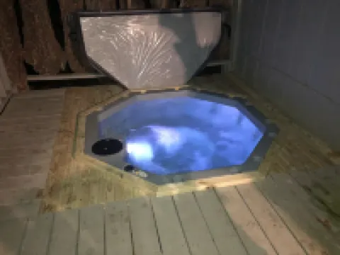 Mountaintop log cabin w/ wood stove hot tub and grill near Lake Chatuge