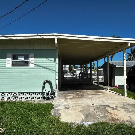 Canal-Front Coastal Escape with Private Dock & King Suite