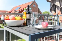 Comfortable apartment on the upper floor for 4 people with balcony, garden & terrace.