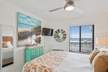 Balcony Suite with Leather Sofa and Kitchen Amenities - Charming Coastal Retreat