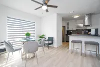 Sleek Kitchen and Cozy Living Area - Inviting Modern Haven Hotels in South Miami Heights
