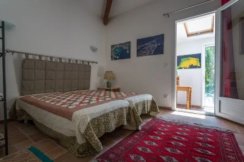 house located in a haven of greenery 15 minutes walk from the beach of Maora