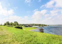 Exclusive Apartment on the Ground Floor Directly Located on the Water Hotels in Kamperland