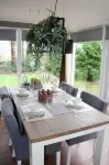 A Detached Bungalow with Outdoor Fireplace Covered Terrace and Pond in a Forest Plot