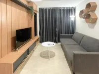 Wooden Accents 1BR at Podomoro City Deli Medan Apartment By Travelio