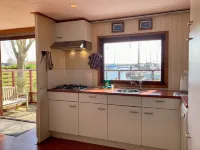 2 Pers. House König Lakeside of the Lauwersmeer with Own Fishing Pier Sauna - balcony
