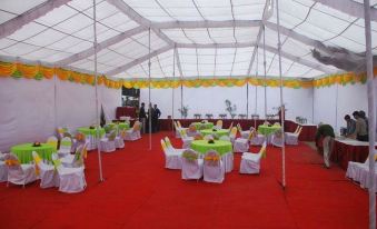 a large white tent with tables and chairs set up for a party or event at Imperial Hotel
