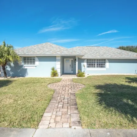 4-bedroom house in Melbourne Beach w/ heated pool and only steps to the beach