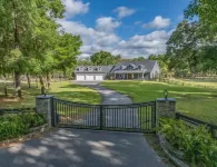 Luxurious 6-bedroom estate with pool, on over 6 fenced in acres