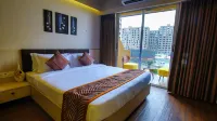 Weekend Address Managed by Living Homes Hotels in Сурат