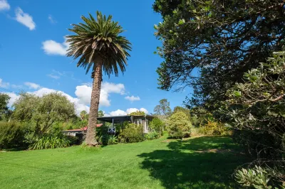 Drop Anchor at Enclosure Bay Beach by Waiheke Unlimited Hotels near Waiheke Musical Museum