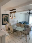 Water front, Minutes walk to beautiful Cowpet Bay Beach, pool, Bar& Restaurants.