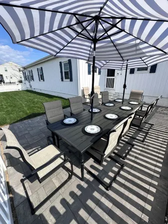 Relax here with beach views, steps to the beach, fenced in yard, pet friendly