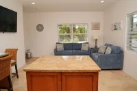 Tranquil 2 Bedroom Rental - 5 Mins to Beach, Private Deck, Pool & Hot Tub Access