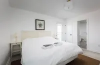 1 min private beach walk. Stylishly renovated with beach views! Hot tub & pool!