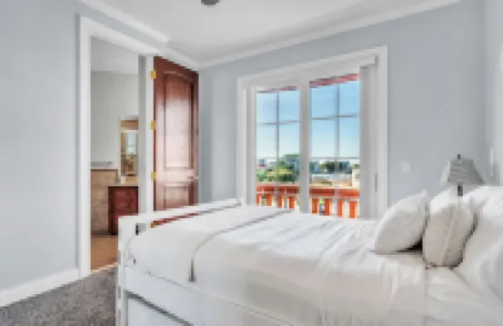 Indulge in Luxury at This Expansive Three-Story Waterfront Retreat.