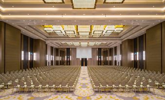 a large conference room with rows of chairs and a projector screen at the front at Hilton Mall of Istanbul