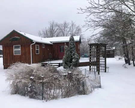 Located Behind a Tree Filled Garden Near Our Horse Barn and Farm Sanctuary. Hotels in Swan Township