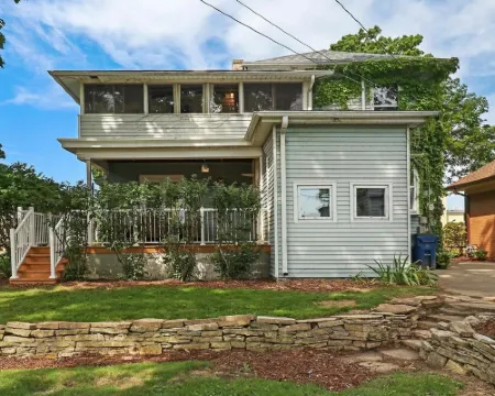 Historic house on tree lined red brick street of historic homes. Hotels in Racine