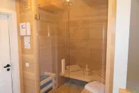 Picturesquely situated thatched-roof house in a large park-like garden