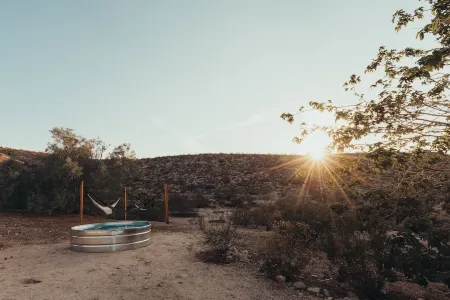 On1.5 acres & surrounded by lots of unbuilt land. Minutes to Joshua Tree & Shops