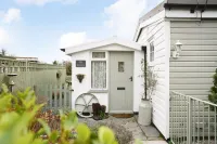 Quirky home with romantic shepherds' hut bedrooms and pretty garden near Padstow