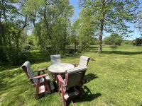 Pristine Waterfront Cottage on the Deer River Hotels near Three Rivers Kayak, Canoe Rental, and Indoor Golf Simulator
