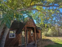 Remodeled Cabin on 40 private acres of Wind River frontage with R/V hookup.