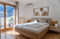 Merano center penthouse with terrace, garage, bike room and infrared sauna.