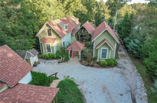 Captain’s Cove Lake Cottage with Dock, Pool, & Game Room
