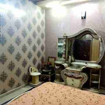 Affordable small family stay in Lahore Rooms