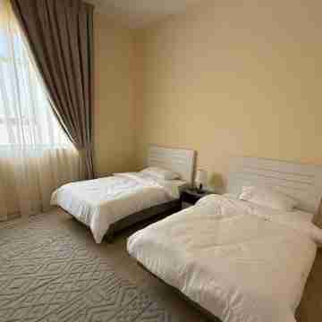 Spacious 4-bedroom apartment with WiFi, AC in terrific Shakhbout City Rooms