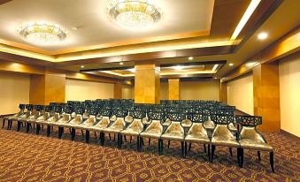 a large conference room with rows of chairs arranged in a semicircle , ready for an event at Royal Alhambra Palace