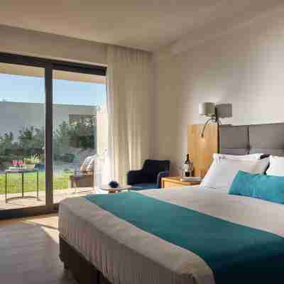 Cavo Orient Beach Hotel & Suites Rooms
