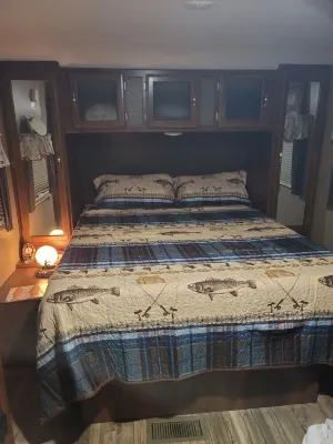Fun Fly fisherman theme RV with AC Hotels near Marigolds Antiques & More