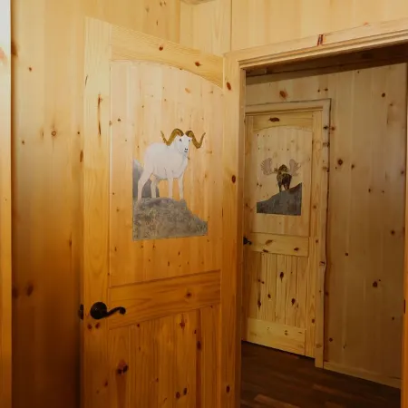 Unique Alaskan log home in trees & wild flowers on 14-acre private homestead.