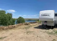 Hammocks & kayaks with1 bed trailer, tiki torches, & tent space for extra guest