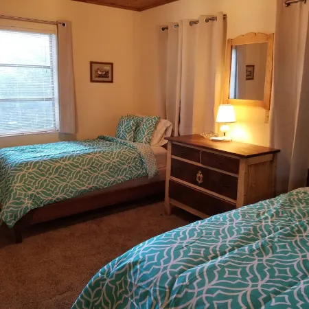 Lakefront getaway with white sand, clear water, gorgeous sunsets