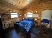 Buckeye cabin is nestled in the woods with access to the Little Missouri River.