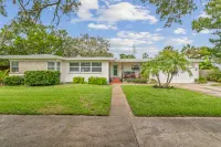 Iconic Front Porch and Timeless Charm - Charming Poolside Oasis