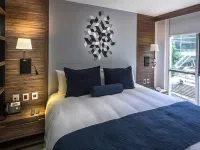 FlowSuites WTC Hotels near Poliforum Siqueiros
