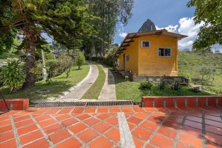 Chiriqui farm in Guatape in front of the Peñol stone