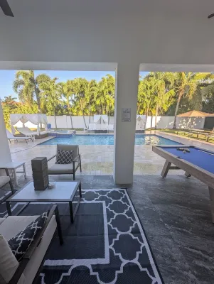 This Miami Vice Villa home is a stunning Saltwater Heated pool/Jacuzzi spa Oasis