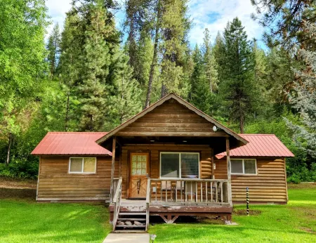 Comfortable Riverside Retreat on 4 acres in secluded Lowman Idaho. Sleeps 45+.